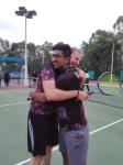 Lobosch gave his partner a hug after they had won their first doubles match in the tennis competition against Chung Chi College.